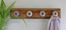 Load image into Gallery viewer, 4 Single Ceramic Ivory Coat Hooks On Wooden Base
